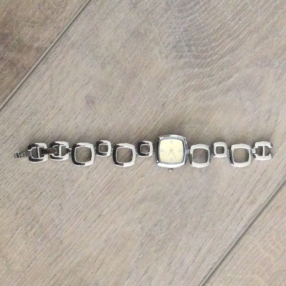 Ladies watch.  Silver color with gold face.